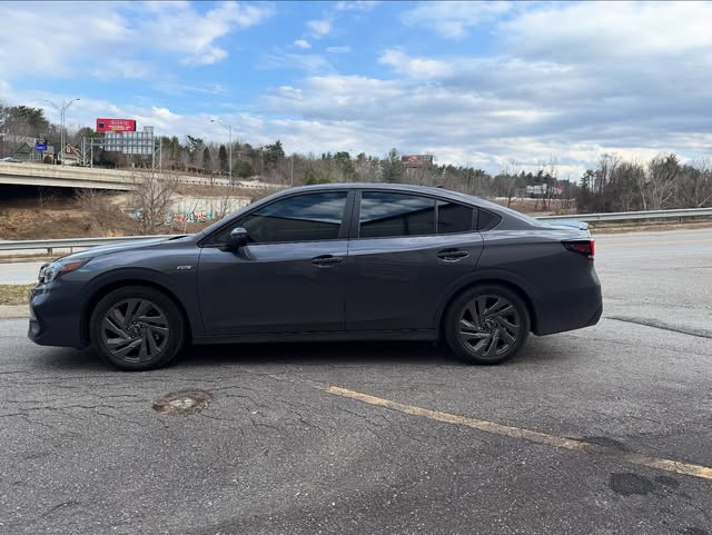 Dark grey sedan with freshly tinted windows